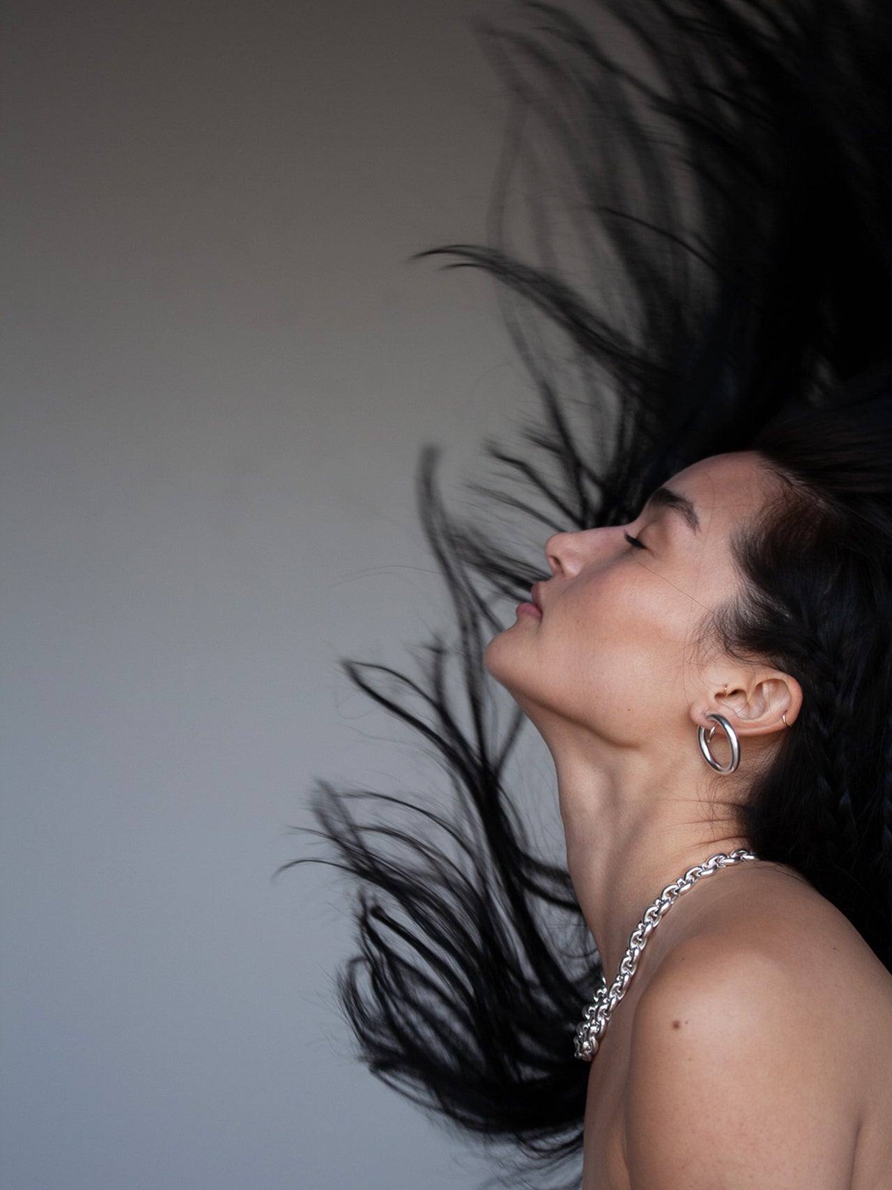 Medium Tru Hoops pictured in sterling silver on model. 