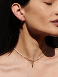 14kt yellow gold bolla hoops shot on models ear. 