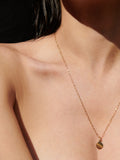 Mini Disk Pendant strung on Long Link Chain, shot on model.