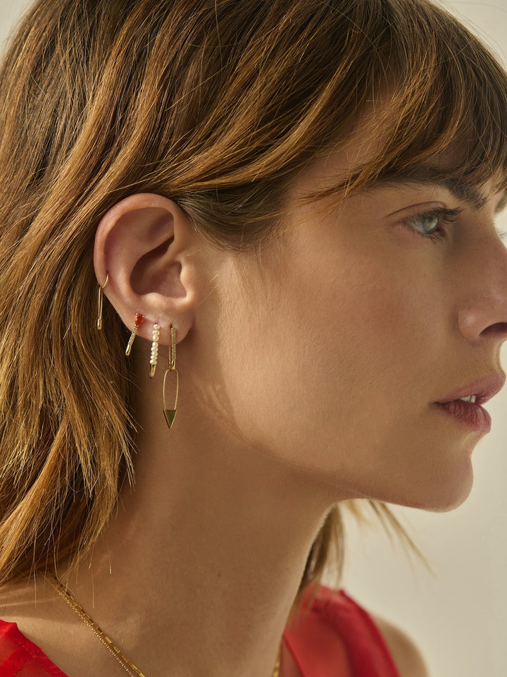 Mini Gemstone Diamond Safety Pin pictured on model. Worn in models third piercing. 