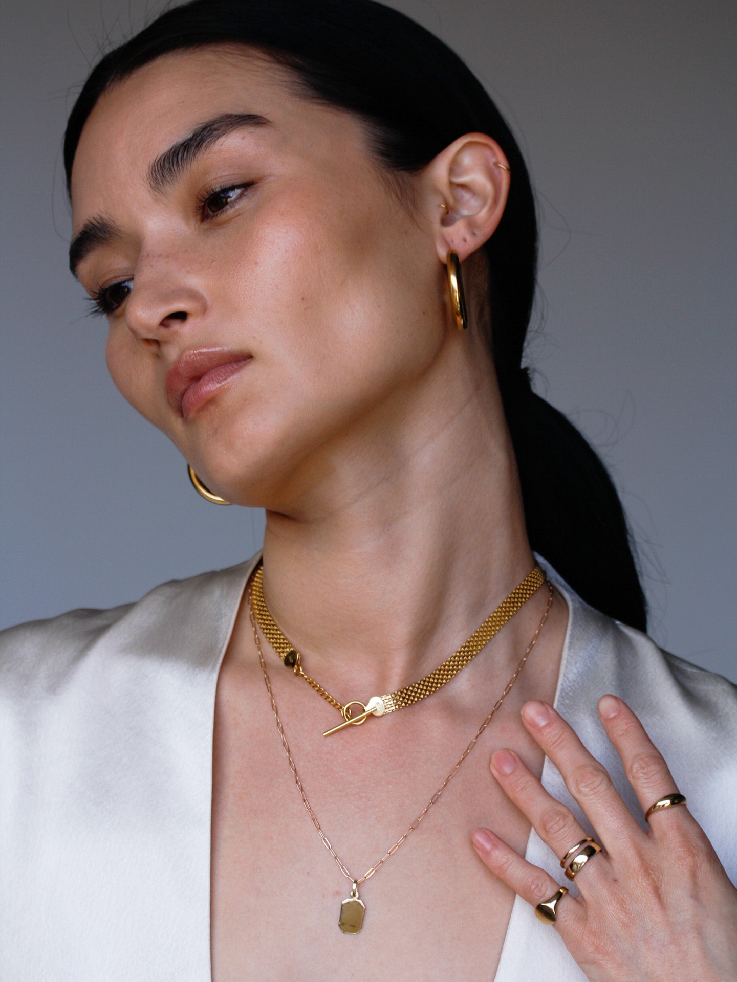 Chainmail necklace pictured with toggle in the front on model. 