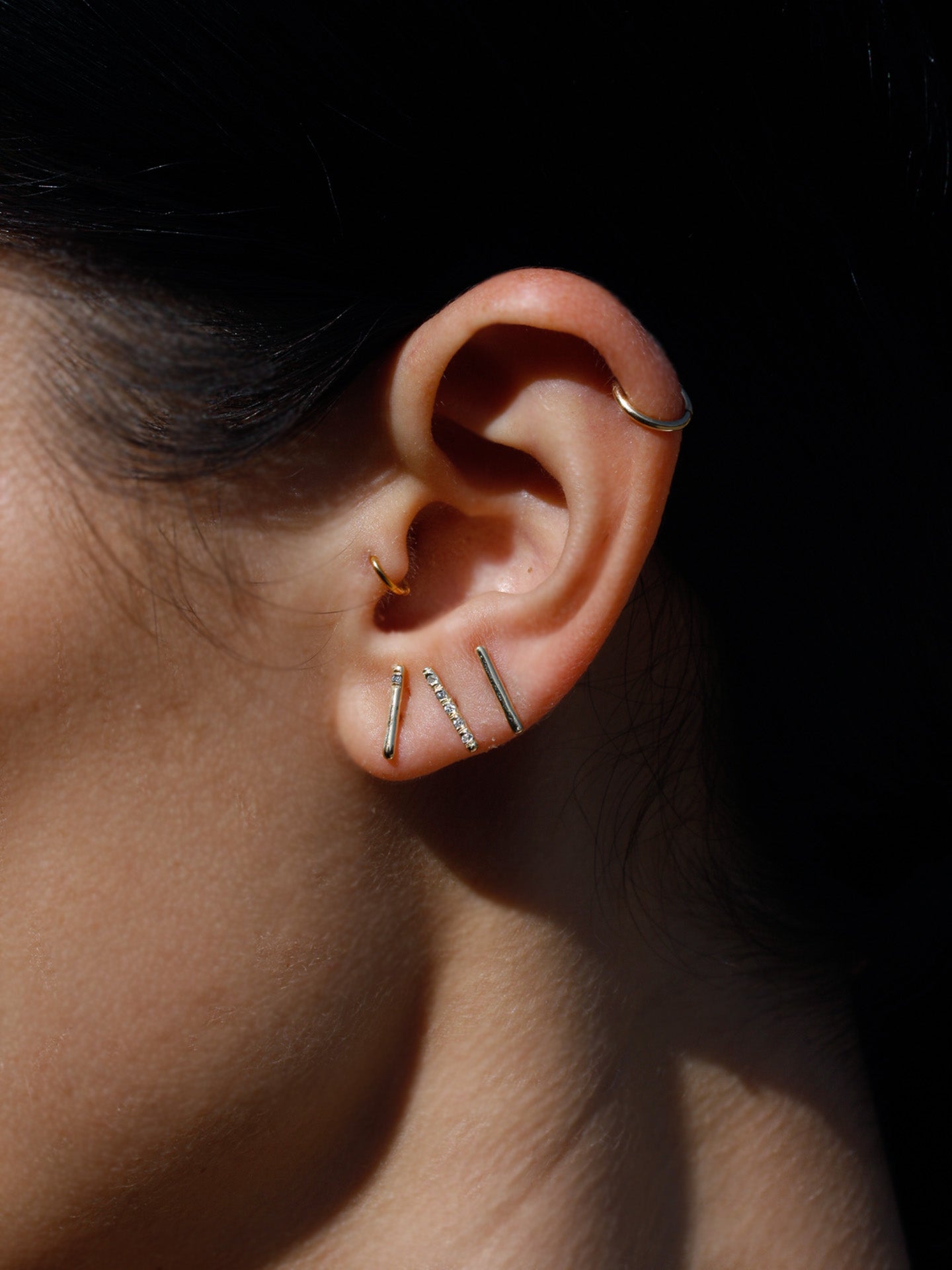 Solo Diamond Rod Stud pictured on models ear. 