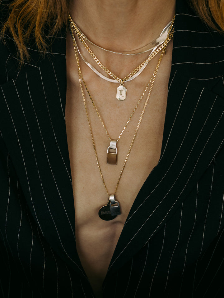 XL Lightweight Havana Chain pictured on model layered with other chains. 