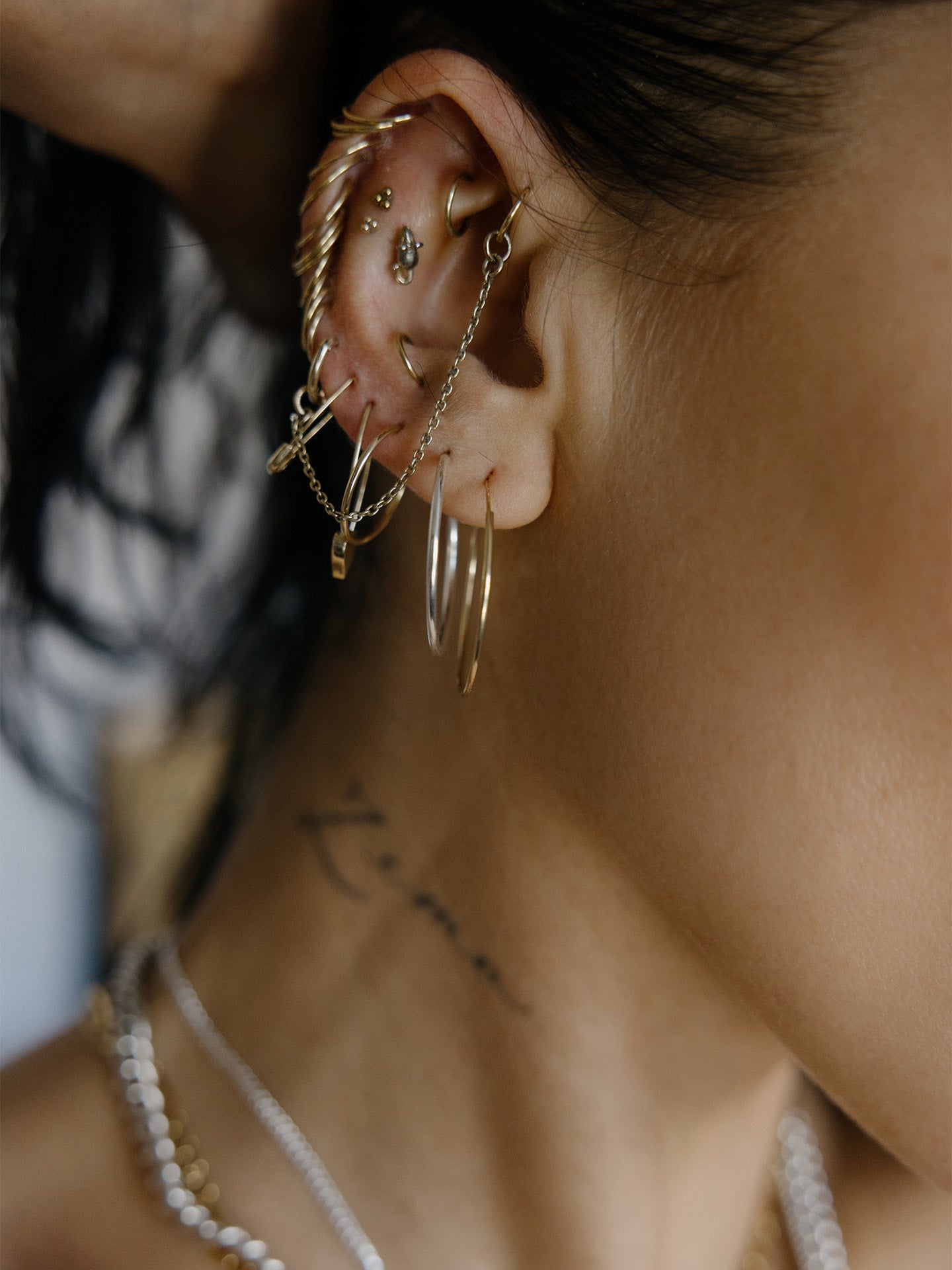 Sterling Silver Riley hoops pictured in models second piercing. Styled with other best sellers.