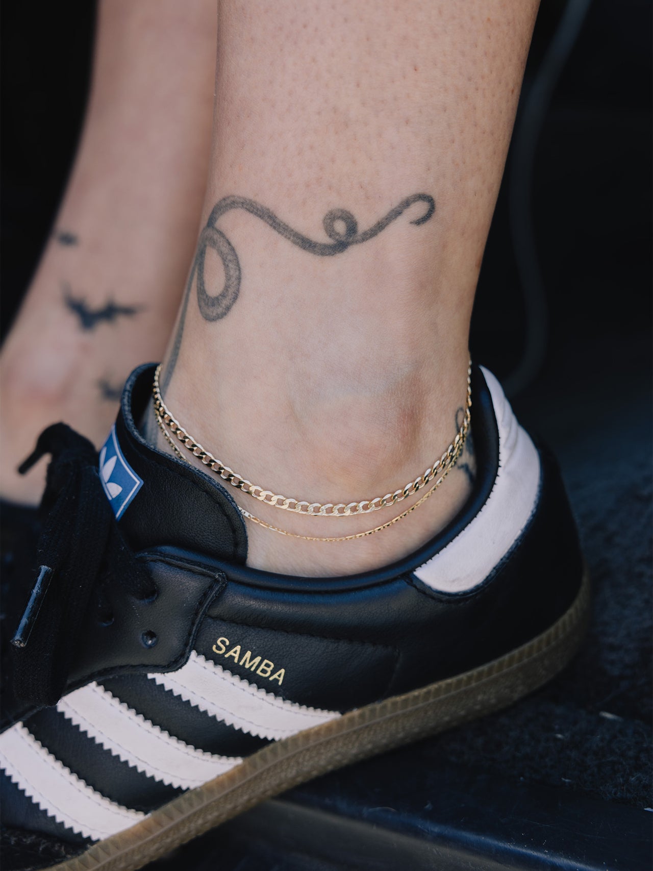 14Kt Yellow Gold XL Lightweight Havana Chain Anklet pictured on models anklet along with the Baby Sol Valentino Anklet. 