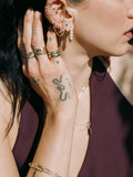 14kt Yellow Gold Pave Hoops pictured in models fourth piercing. 