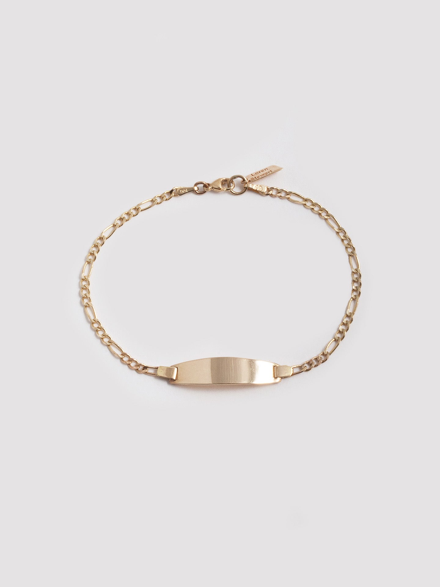 Mini Ellipse ID Bracelet pictured on light grey background.