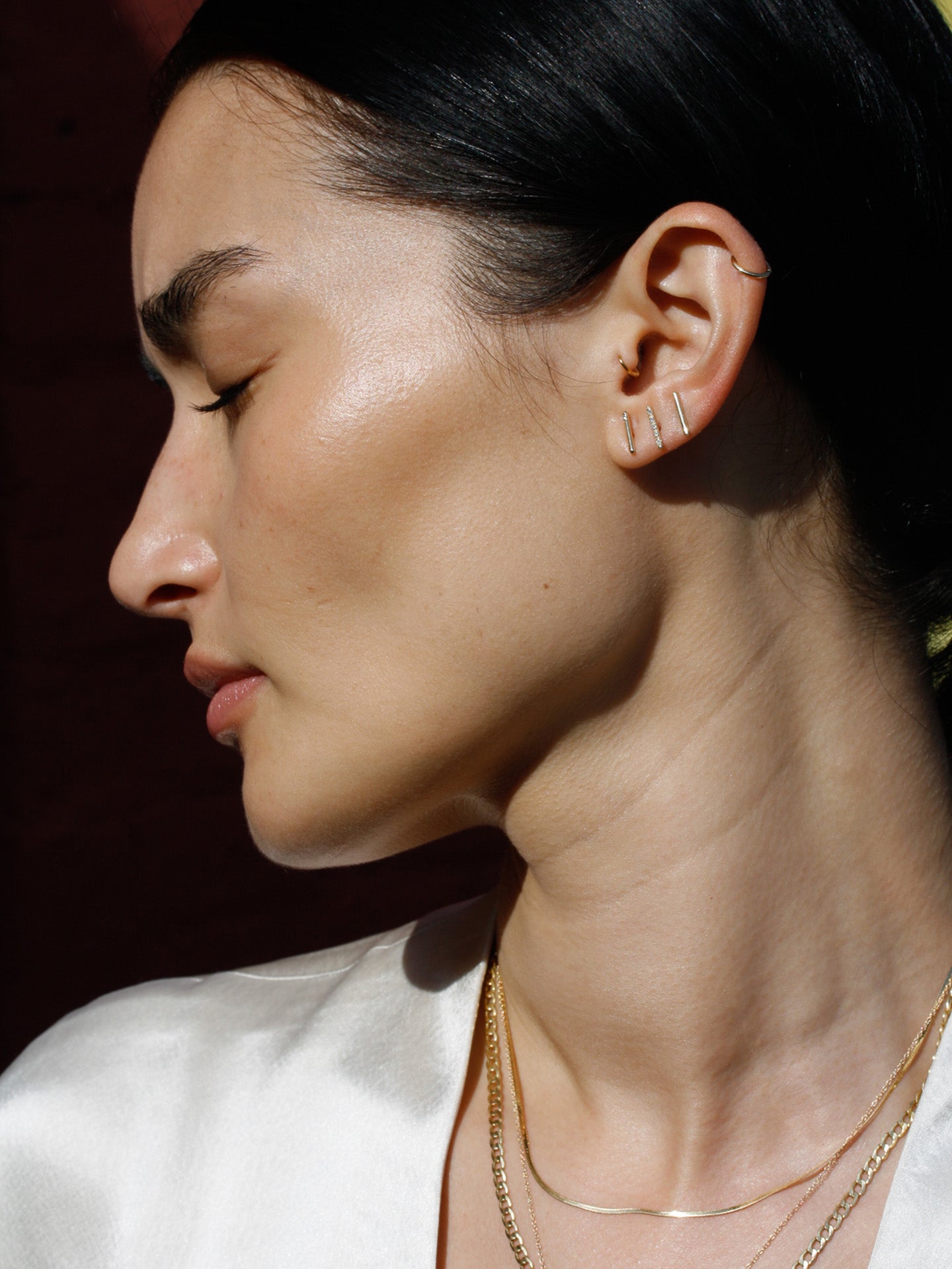 Solo diamond rod stud pictured in models first piercing. 