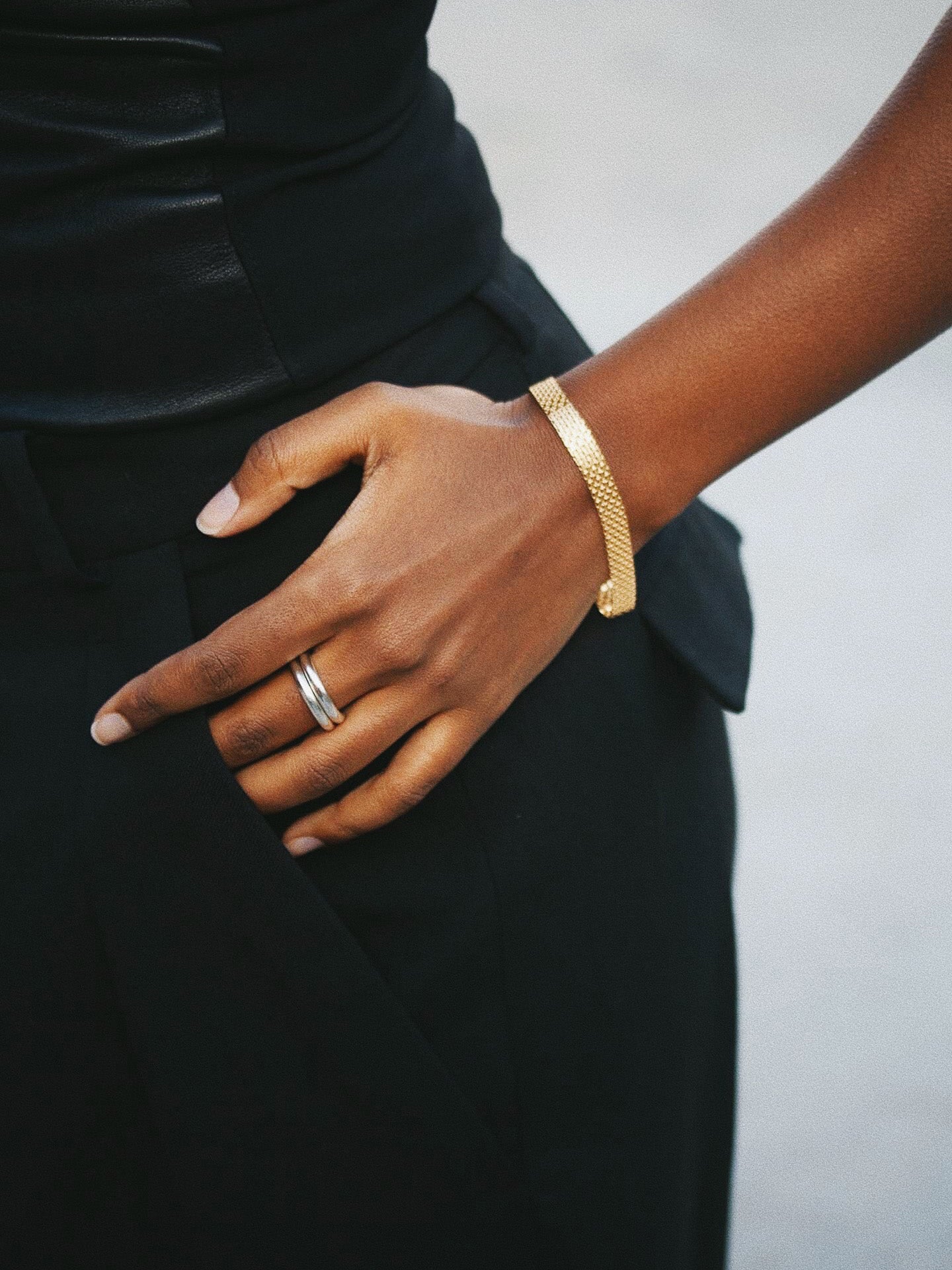 Chainmail Bracelet pictured on models wrist. Light grey background. 