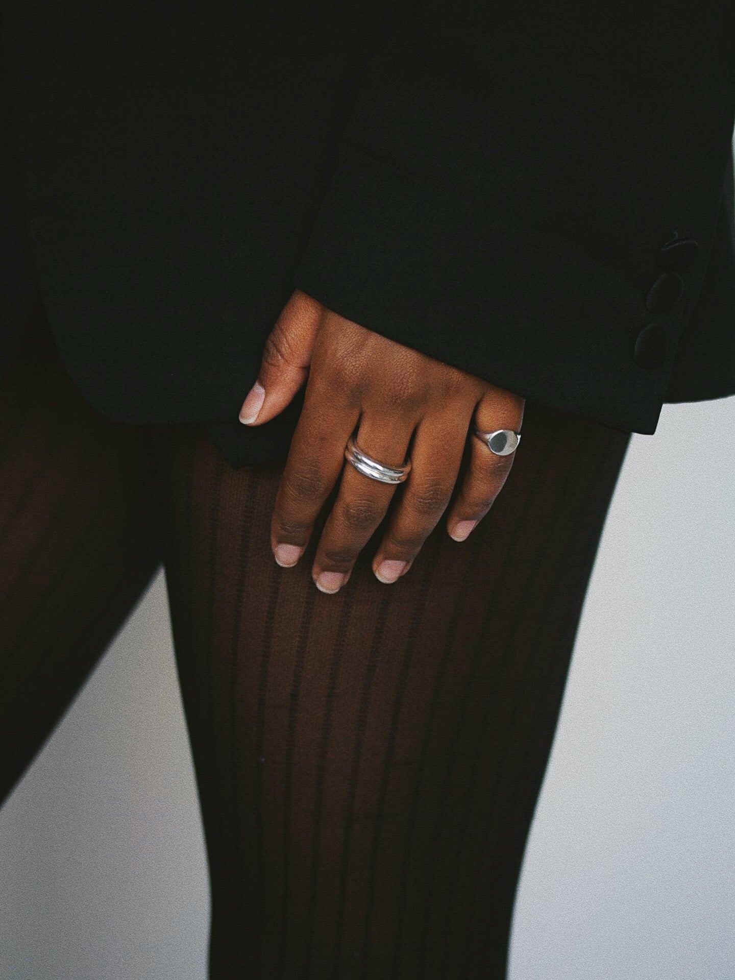 Baby Signet ring pictured on models pinky finger. Light grey background. 