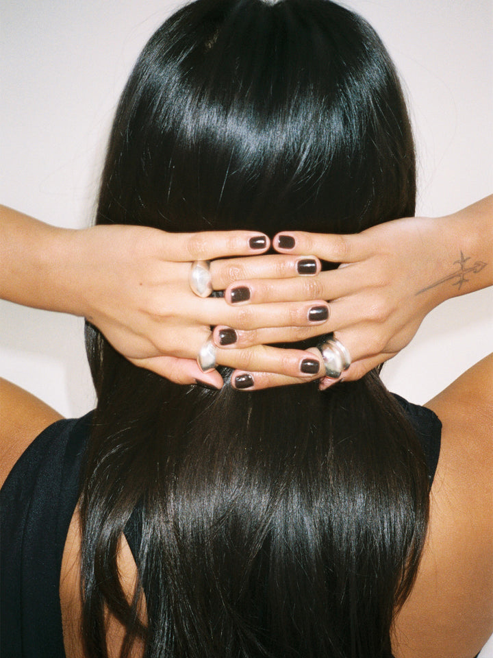 Sterling Silver Hollow Dome Cuff pictured layered on models hands