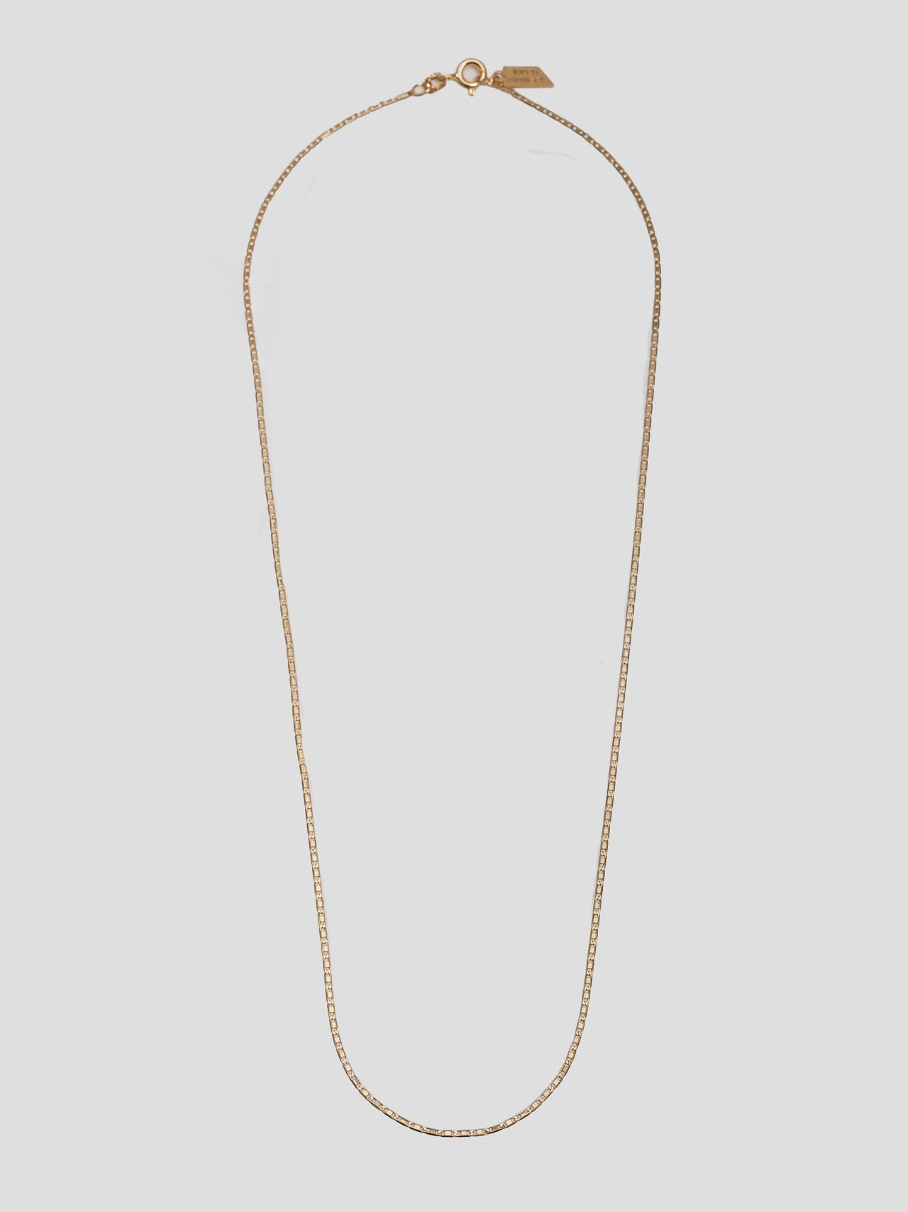 10kt Yellow Gold Valentino Chain pictured on light grey background. 