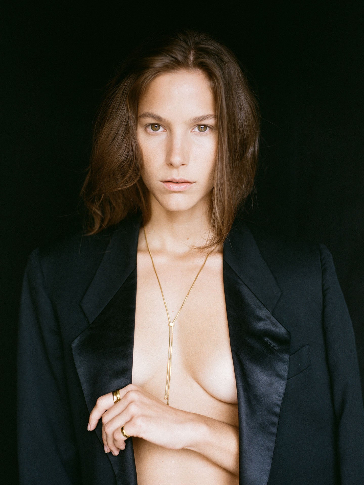 Vermeil Bolo Pendant Necklace pictured on model. Black background. 