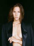 Vermeil Bolo Pendant Necklace pictured on model. Black background. 
