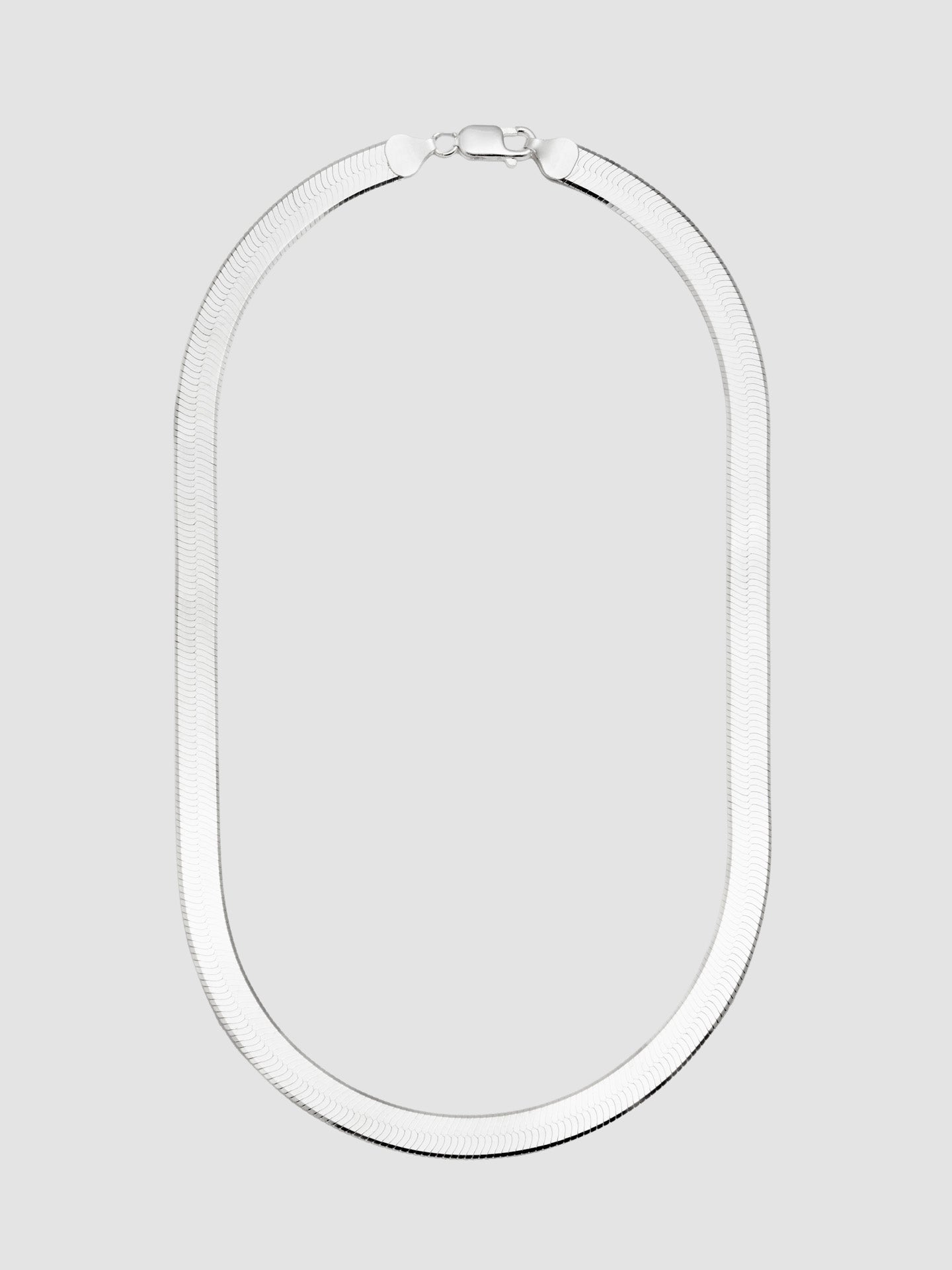 Sterling Silver Herringbone Chain Necklace shot on light grey background.