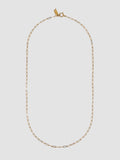 Gold chain necklace on a light gray background