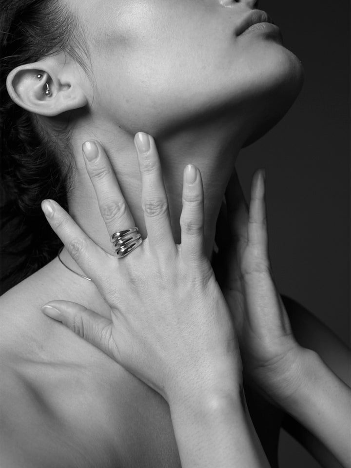 14Kt Yellow Gold Dome Ring pictured stacked on models middle finger