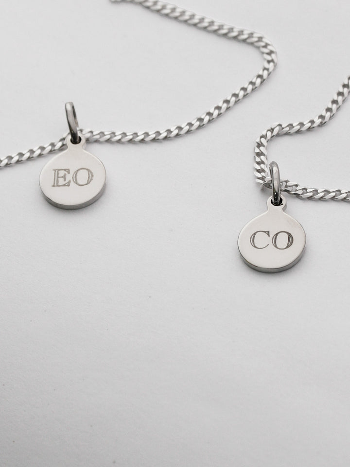 Sterling Silver Petite Havana Chain strung with the Mini Disk Pendant. Engraved initials with Block Font. 