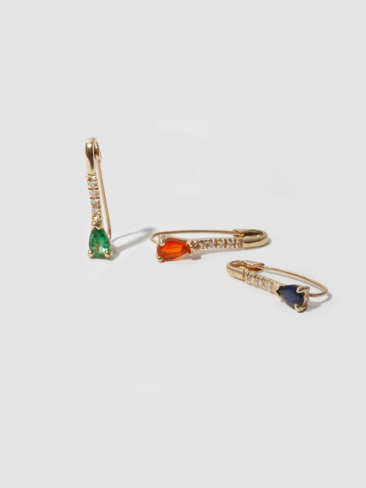 14kt Yellow Gold Mini Gemstone Diamond Safety Pin in Dark Blue Sapphire, Tsavorite, and Fire Opal. 