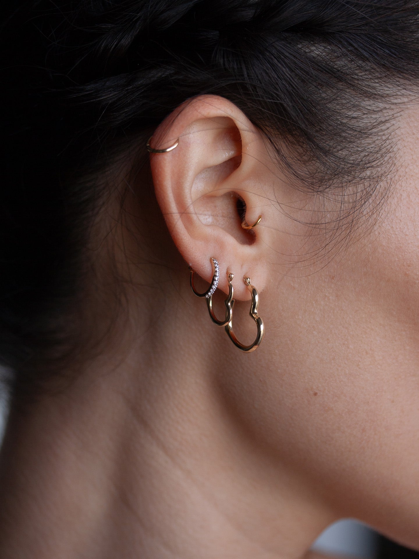 Heart feels pictured in models ear. Second piercing. 