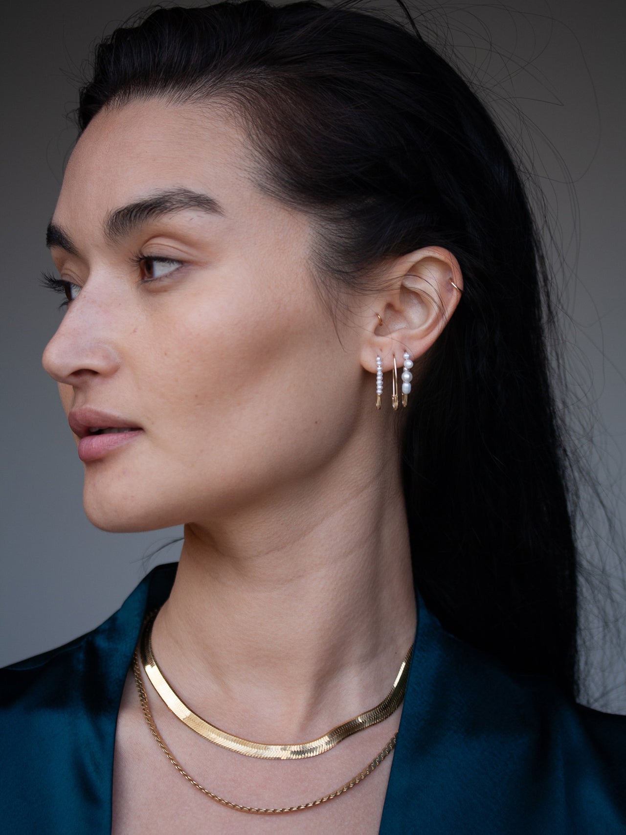 Mixed Pearl Safety Pin Earring pictured in models third piercing. 