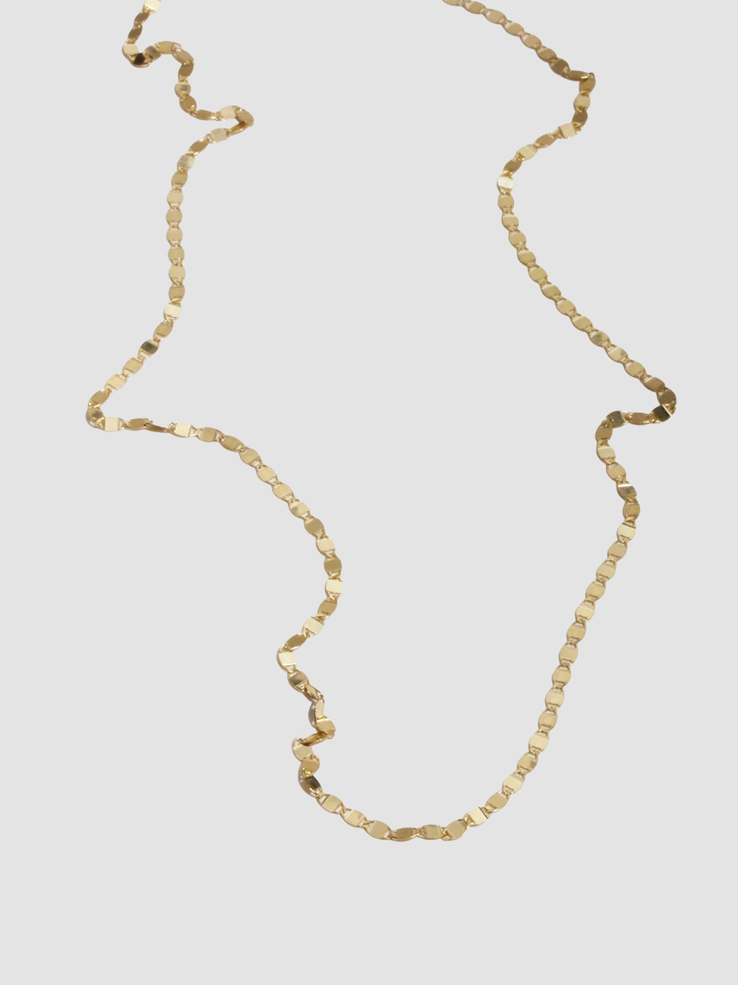 Product image of yellow gold valentino chain necklace on white background. 
