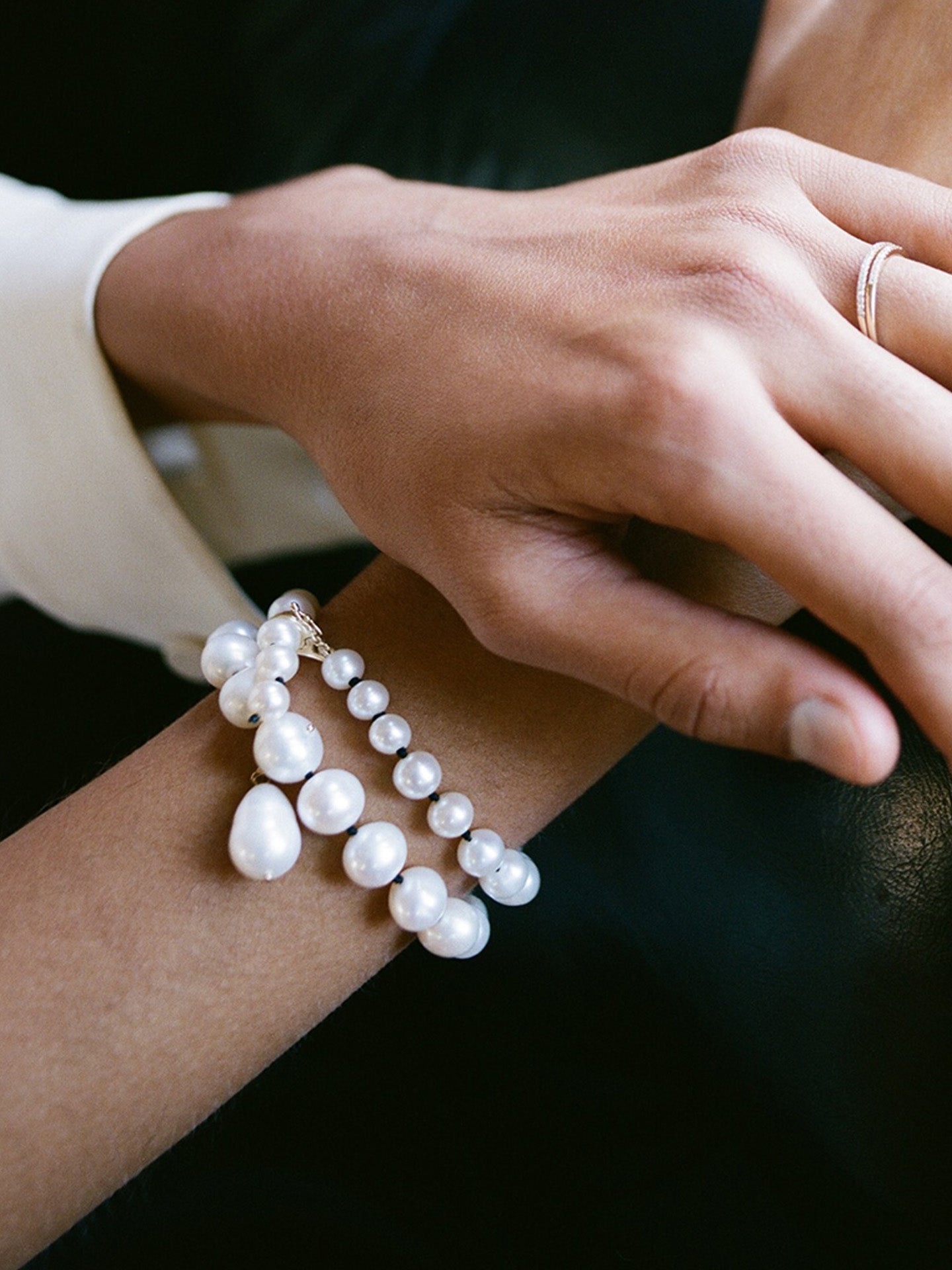 14kt Yellow Gold Boujee Pearl Strand pictured as wrap bracelet.
