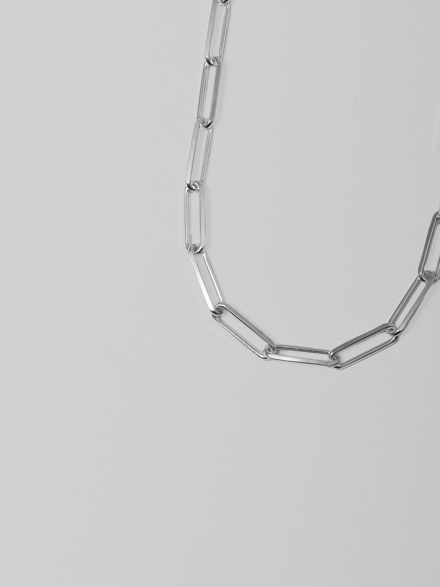 Sterling Silver Hollow Long Link Chain pictured on light grey background.