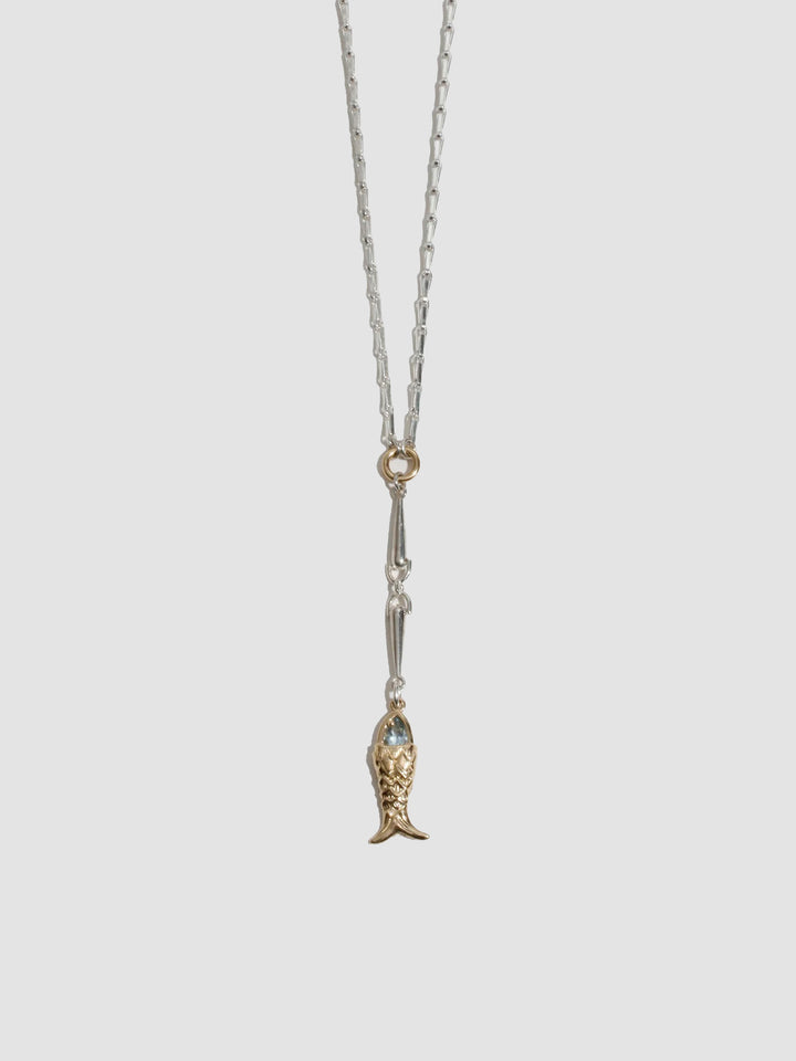 Necklace with a fish-shaped pendant on a light gray background