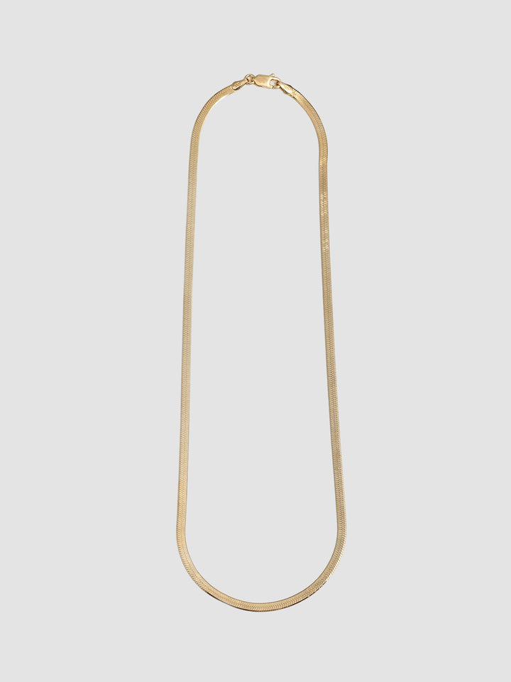Vermeil Herringbone Chain Necklace pictured on light grey background. 