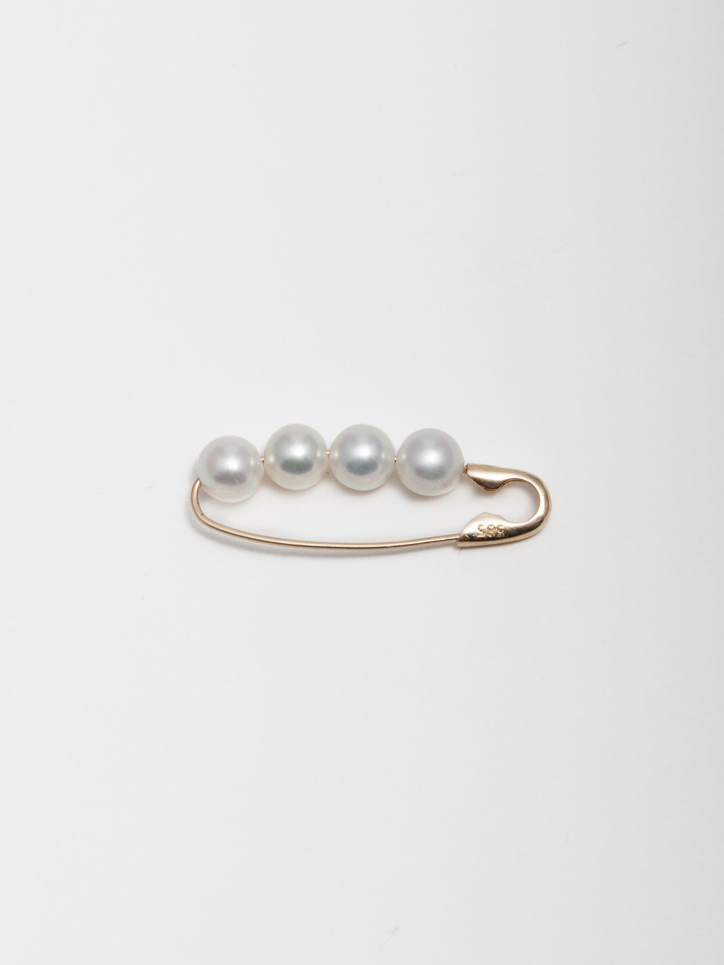 14kt Yellow Gold XL Pearl Safety Pin Earring pictured on light grey background.