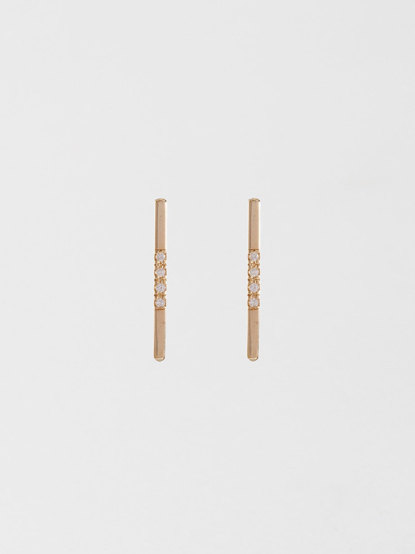 14kt Yellow Gold Diamond Rod Stud Earring pictured as pair on light grey background.