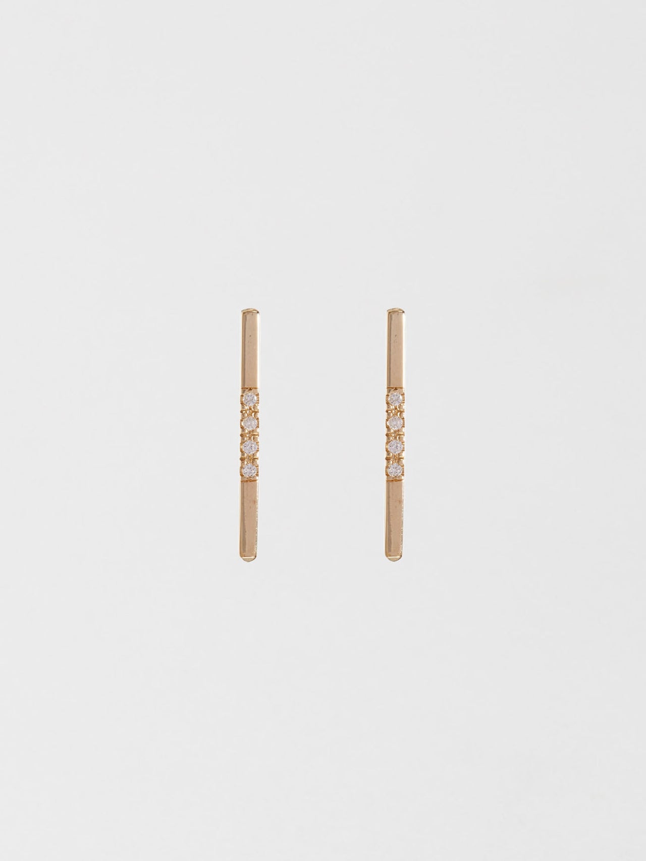 14kt Yellow Gold Diamond Rod Stud Earring pictured as pair on light grey background.