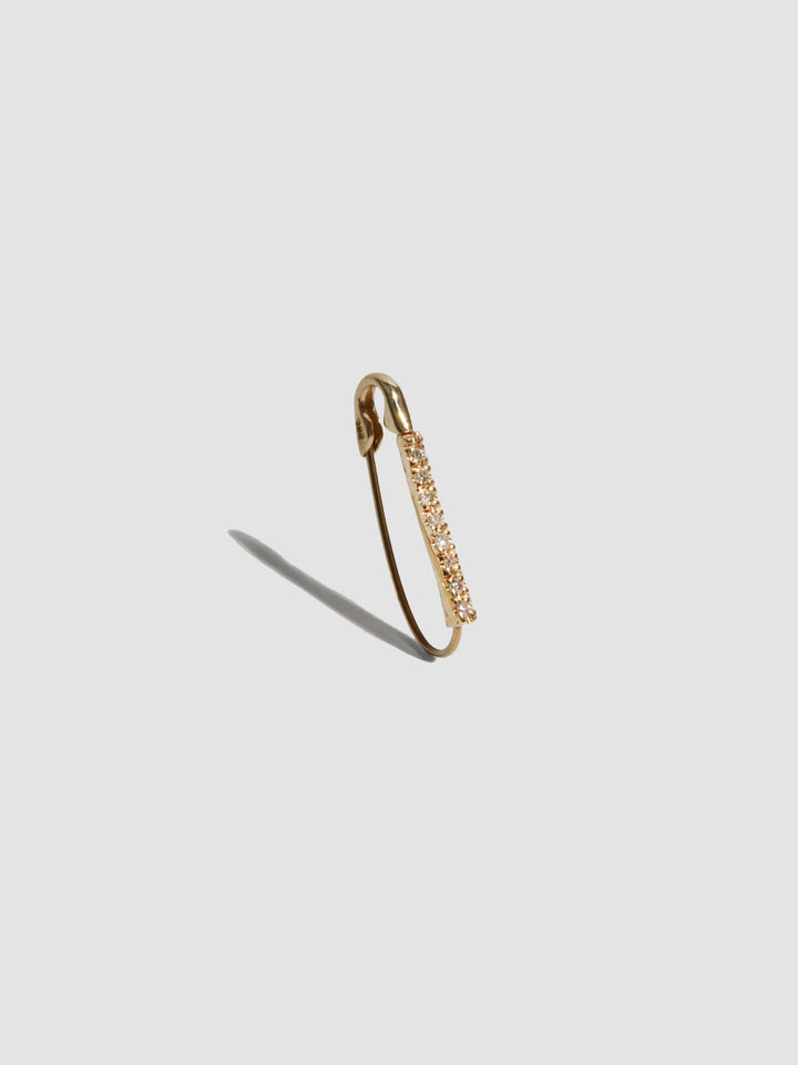 Diamond Safety Pin on light grey background.
