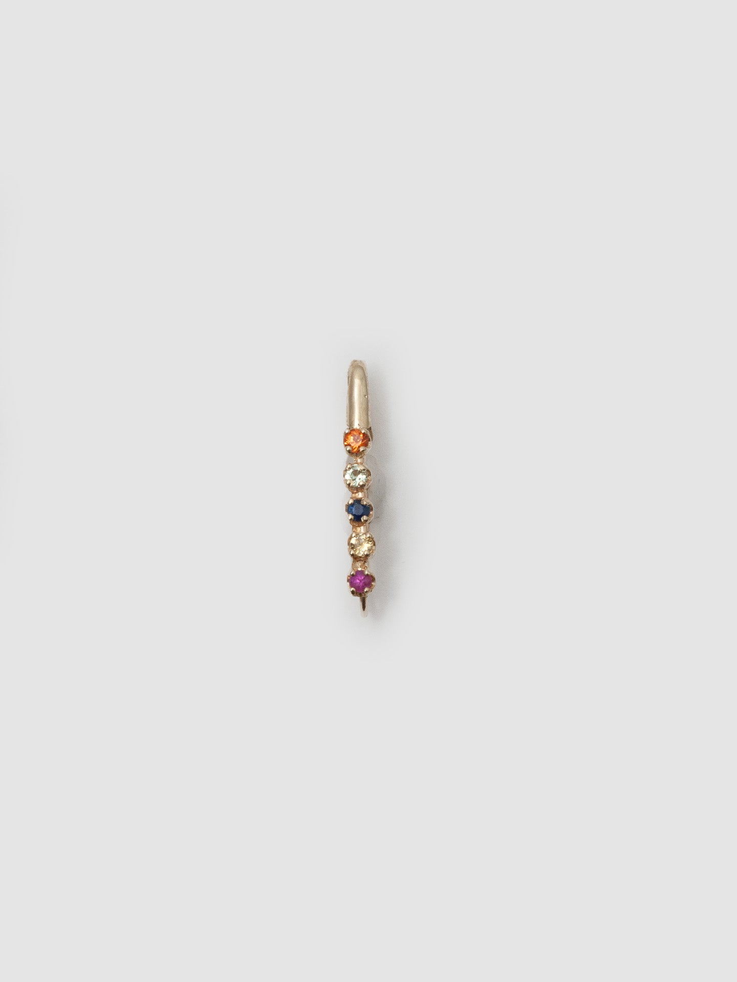 14kt Yellow Gold Sunset Safety Pin pictured on light grey background. 