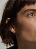 14kt Yellow Gold Mini Sapphire Baguette Safety Pin Earring pictured on model.