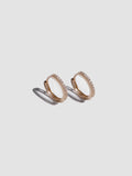 A pair of 14kt yellow gold pave hoop earrings with cubic zirconia, displayed against a white background.