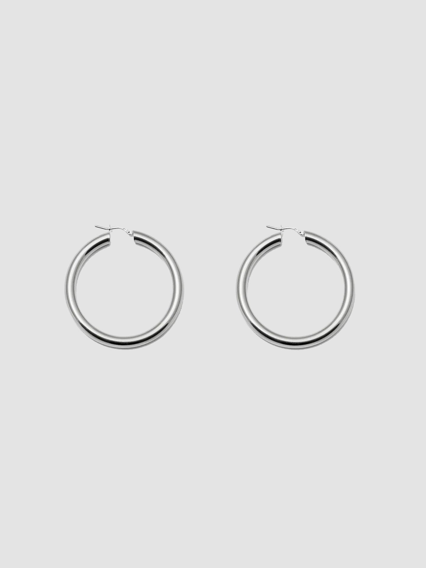 Product shot of the Tru Hoops in Sterling Silver (Sterling Silver Hoops 49.5mm diameter  5mm thick) Background: Grey backdrop