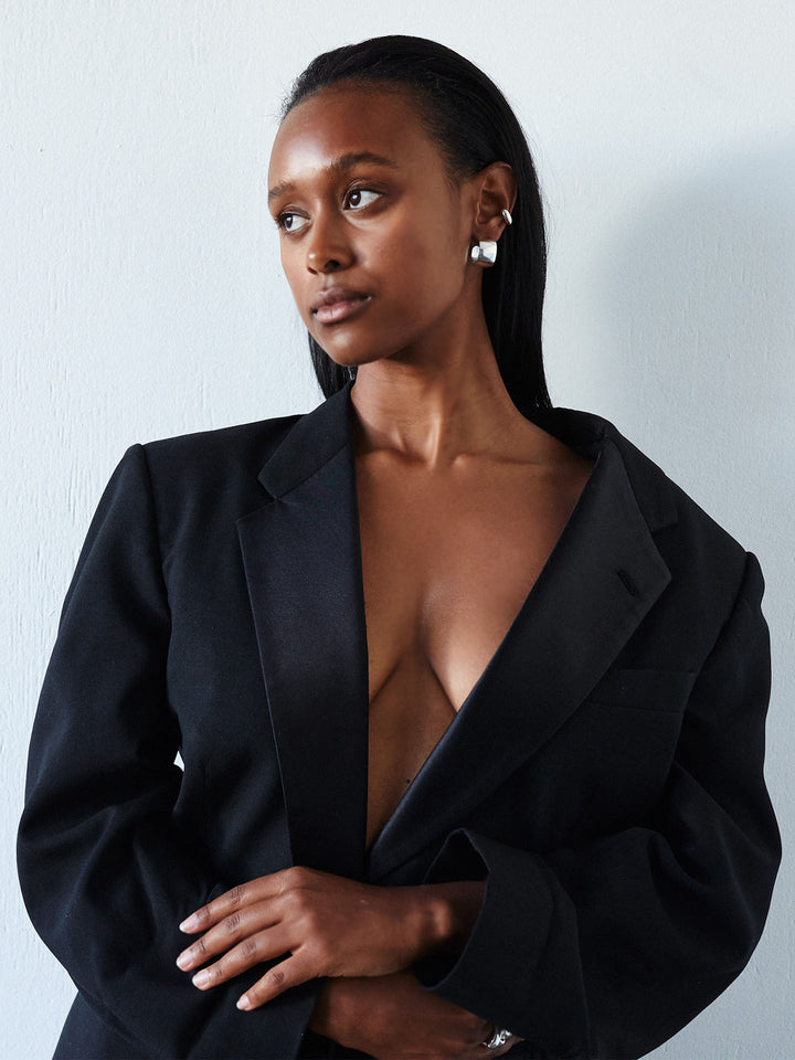 Sterling Silver Midi XL Dome Hoops pictured on model. Light grey background.
