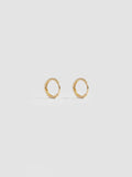 Product shot of the Elfin Mini Huggies (14KT Yellow Gold  8.6mm Diameter 1.4mm Thick) Background: Grey backdrop