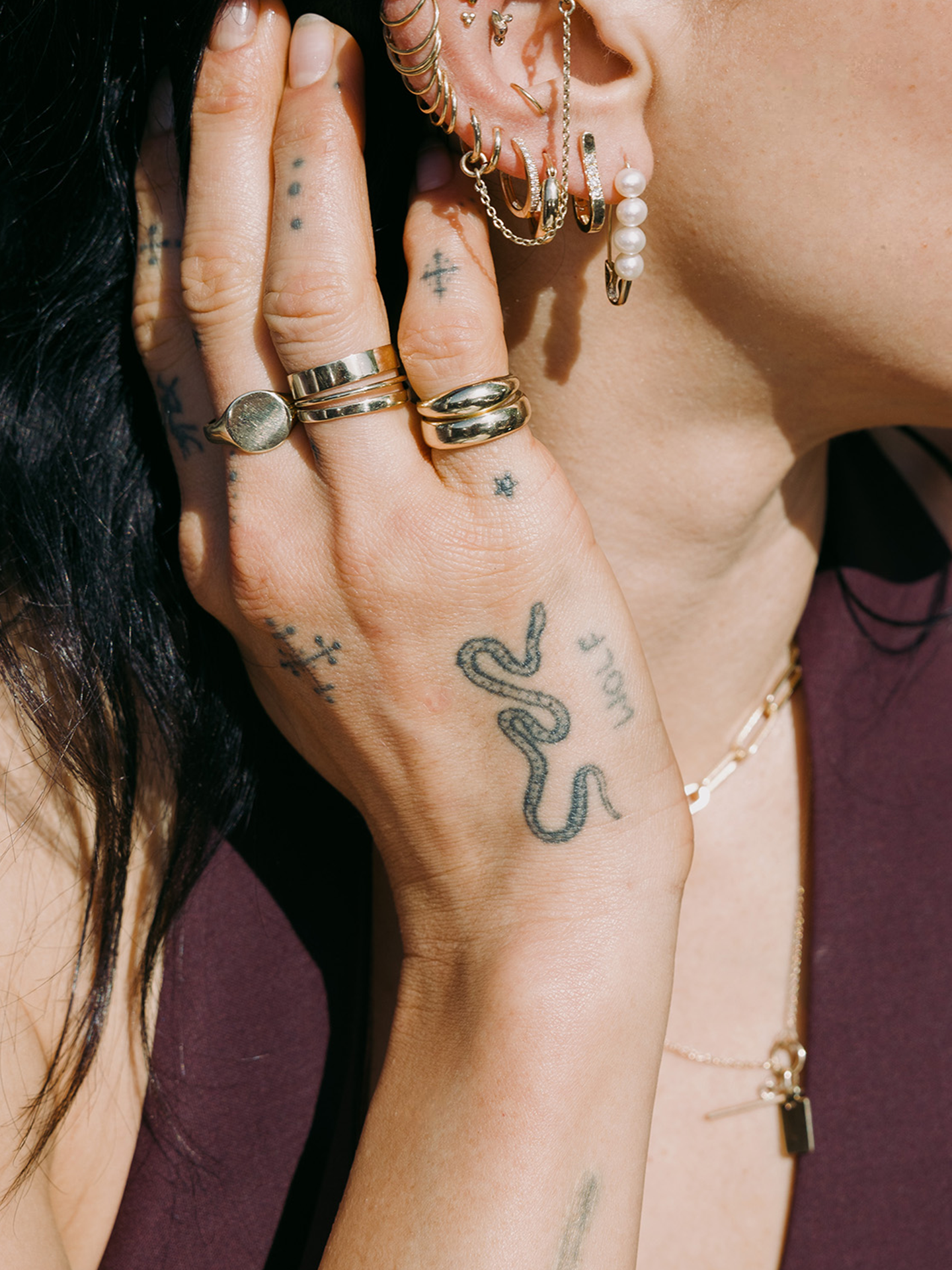 14kt Yellow Gold Echo Band pictured on models ring finger. Stacked with the Hug Band.