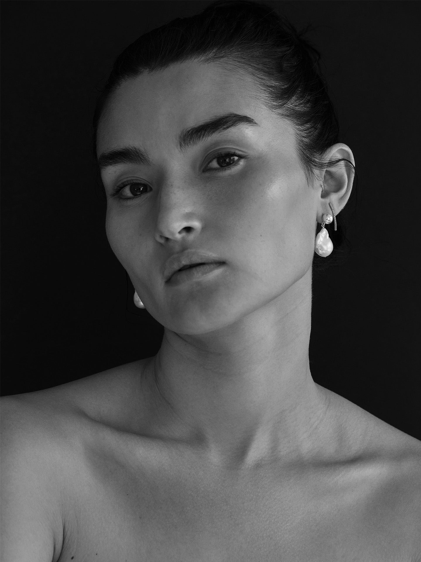 Sterling Silver &amp; Freshwater Drop Earrings pictured on model. Black and white photo. 