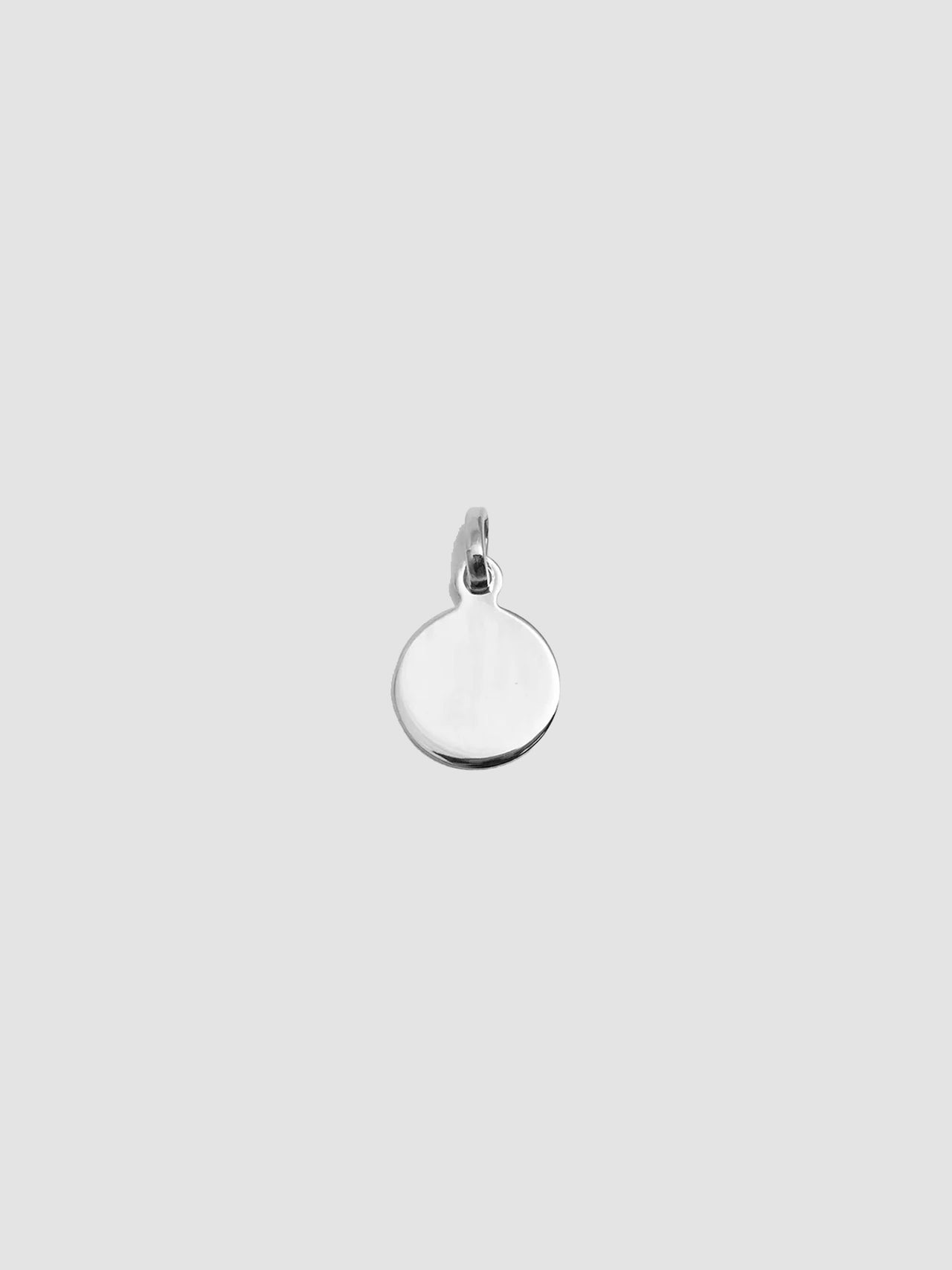 Mini Disk Pendant pictured on light grey background. 