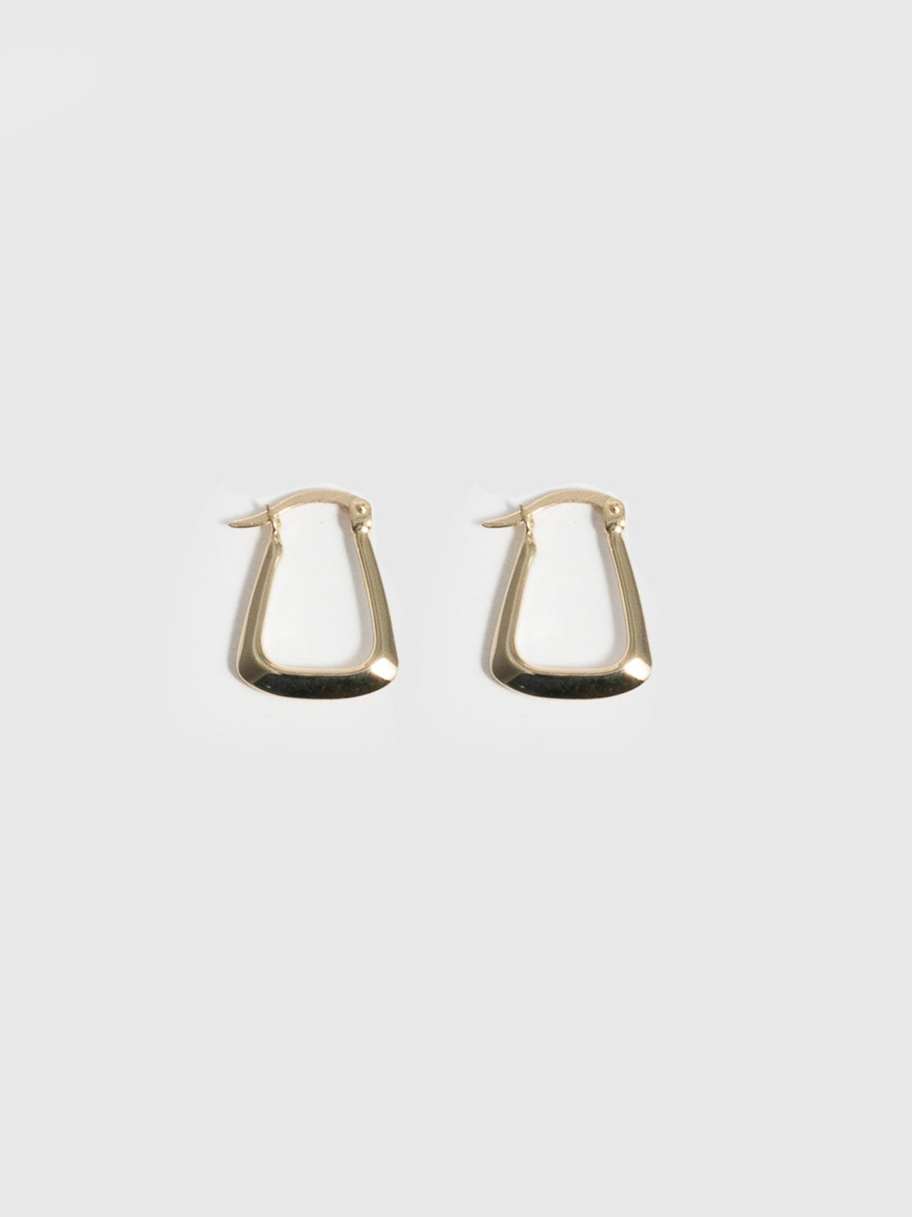 14kt Yellow Gold Hoops Trifecta Hoops pictured on light grey background. 