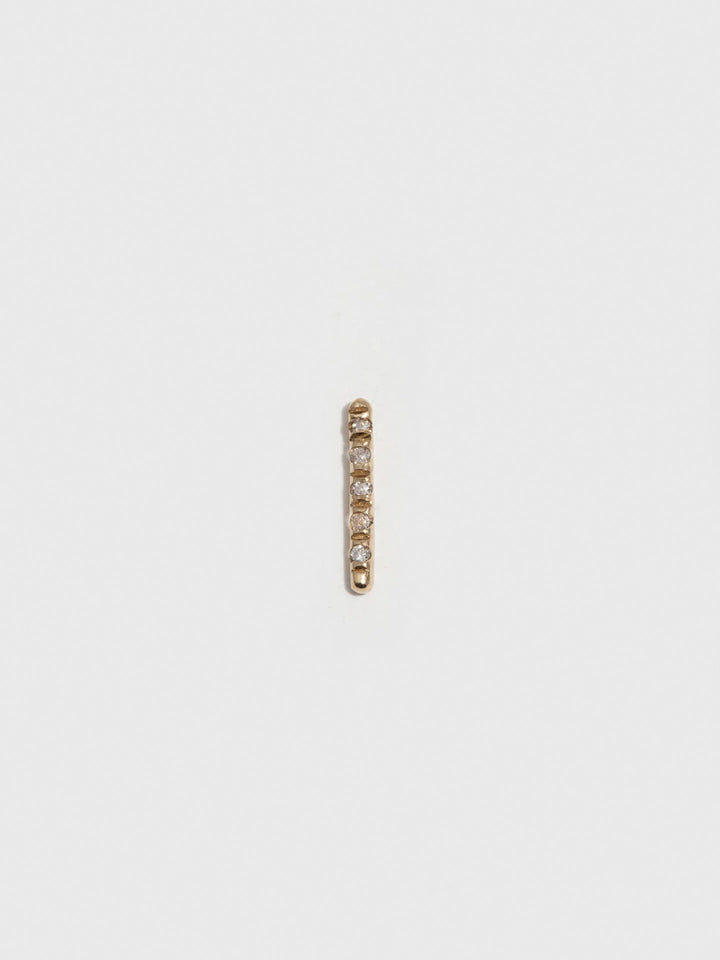 14kt Yellow Gold Solo Diamond Rod Stud Earring pictured on light grey background. Single.