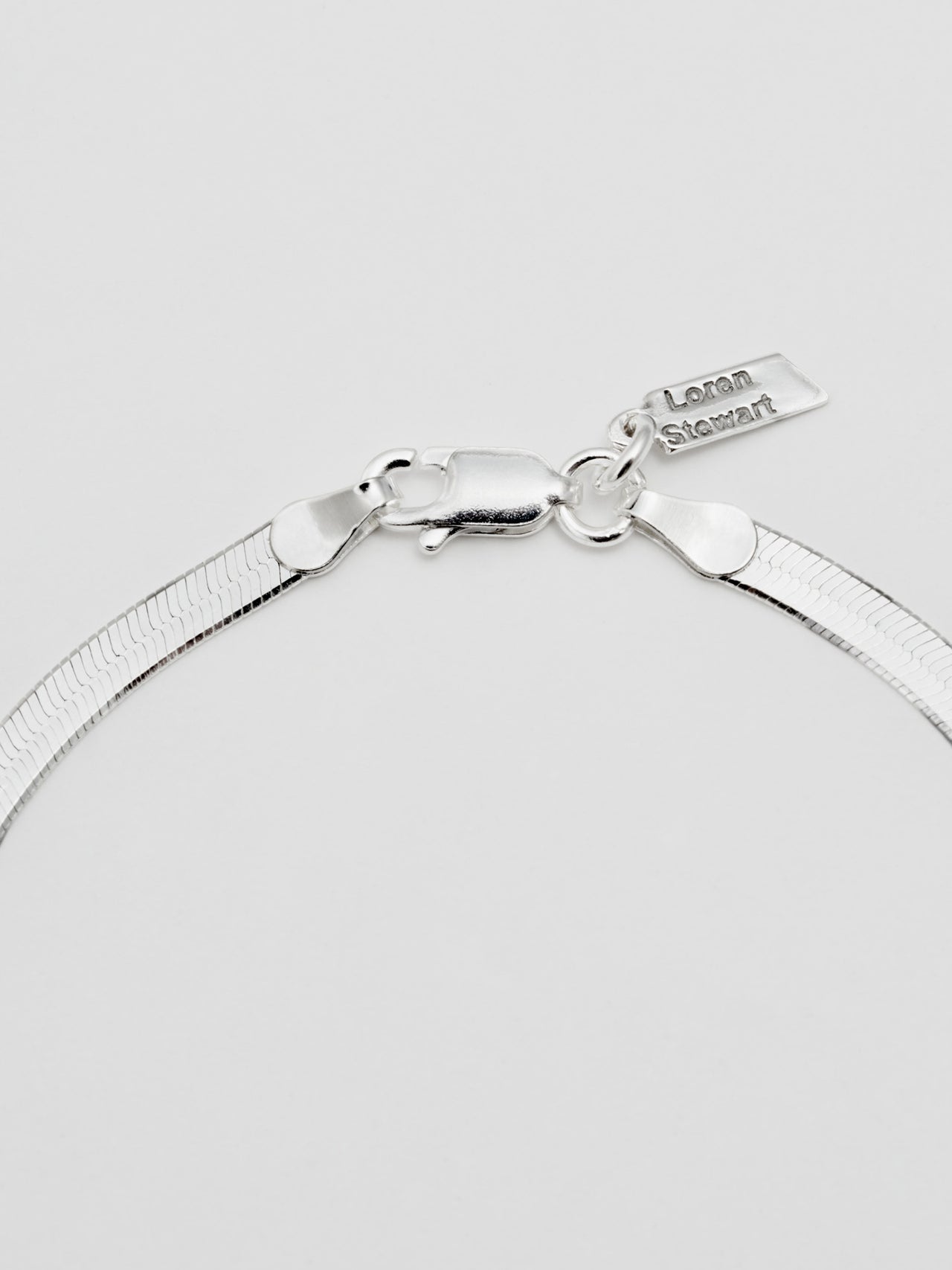 Sterling Silver Herringbone Bracelet: Sterling Silver Herringbone Chain Bracelet  Length: 7”  Width: 3.5mm