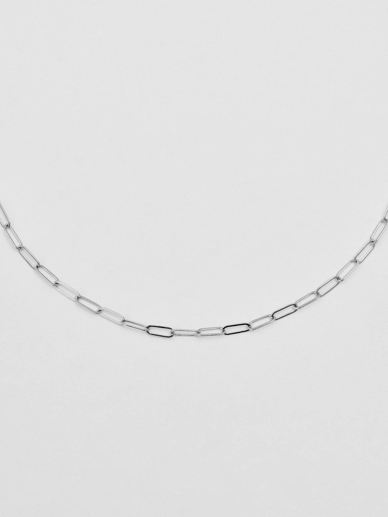 Close up picture of the Sterling Silver Lightweight Long Link Chain pictured on light grey background. 