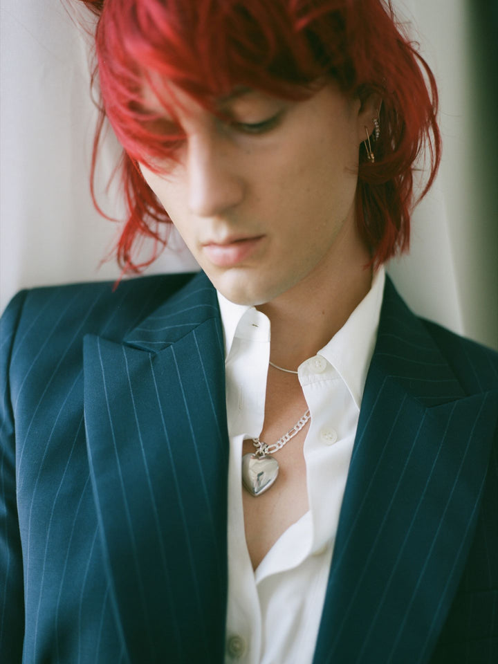 Sterling Silver Heart Locket pictured on Sterling Silver XL Figaro Chain - on models neck.
