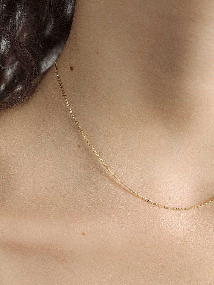 Close up of Thin Curb Chain shot on model