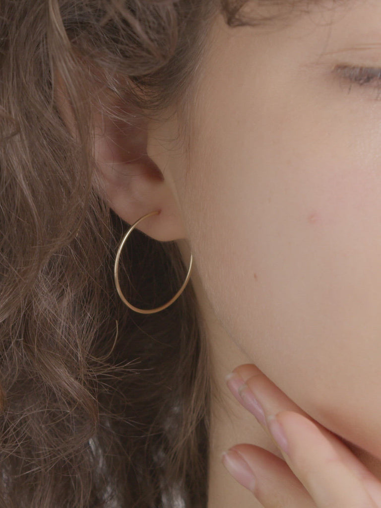 Model shot of Winona Hoops (14Kt Yellow Shiny Gold Thin Hoops)